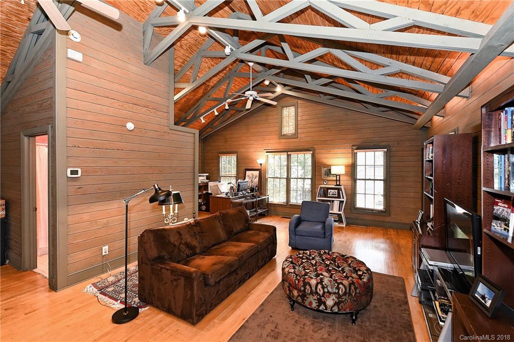 1626 Queens Road West Charlotte, NC 28207 - Photo 34 of 36 a living room with furniture a couch and a chandelier