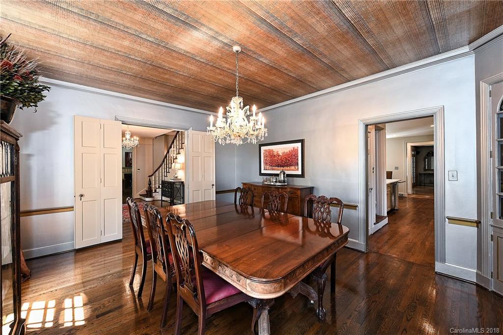 1626 Queens Road West Charlotte, NC 28207 - Photo 6 of 36 a dining room with furniture a chandelier and wooden floor