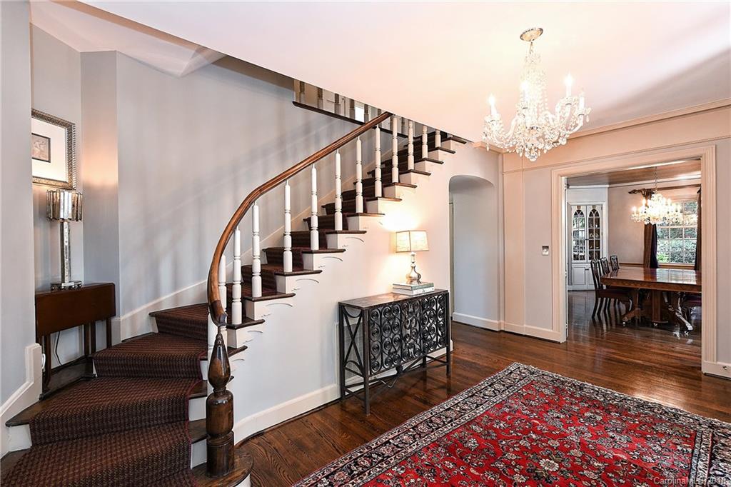 1626 Queens Road West Charlotte, NC 28207 - Photo 7 of 36 a living room with furniture and a chandelier