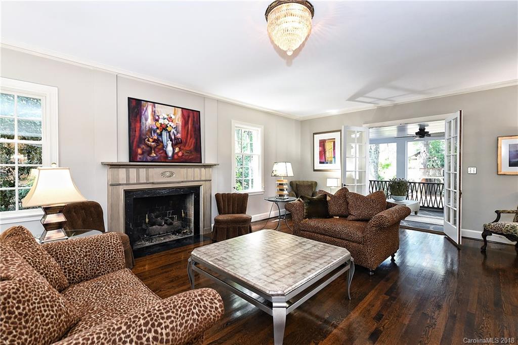 1626 Queens Road West Charlotte, NC 28207 - Photo 8 of 36 a living room with furniture a fireplace and wooden floor