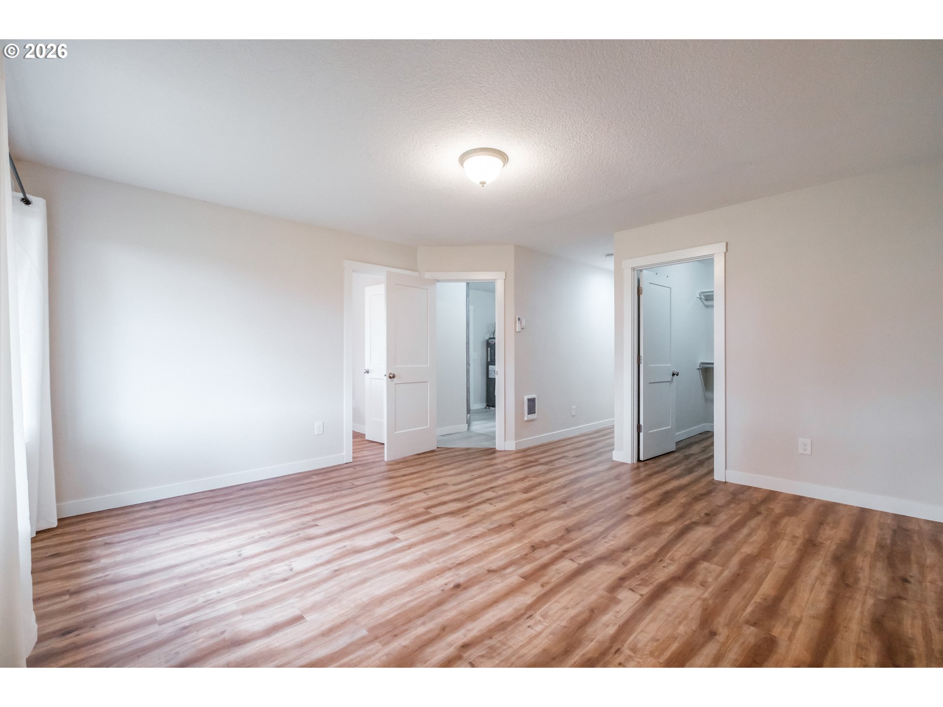 10471 Wagon Road Northeast Mount Angel, OR 97362 - Photo 15 of 48 a view of an empty room with wooden floor