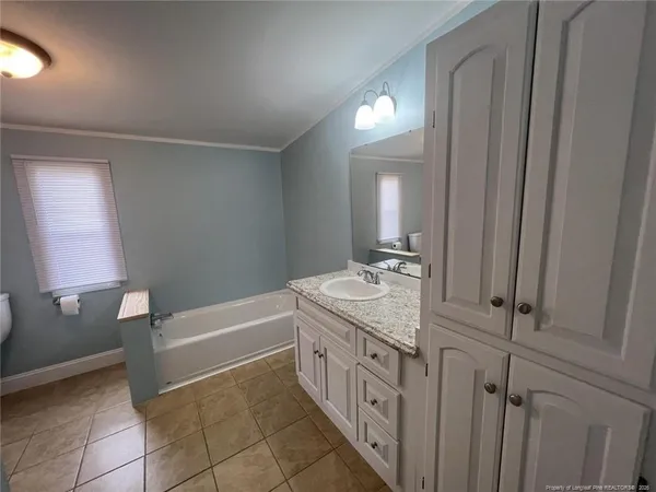 a bathroom with a sink and toilet