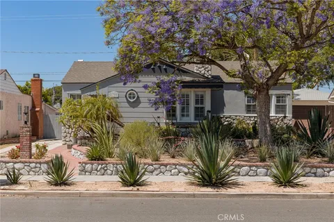 a view of front of house with a yard