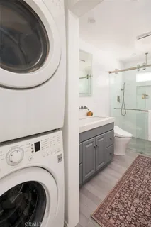 a utility room with sink dryer and washer