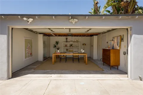 a view of a room that has a table and chairs in it