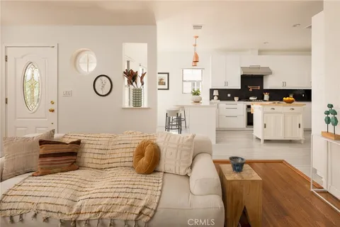 a large bedroom with a bed furniture and a large window