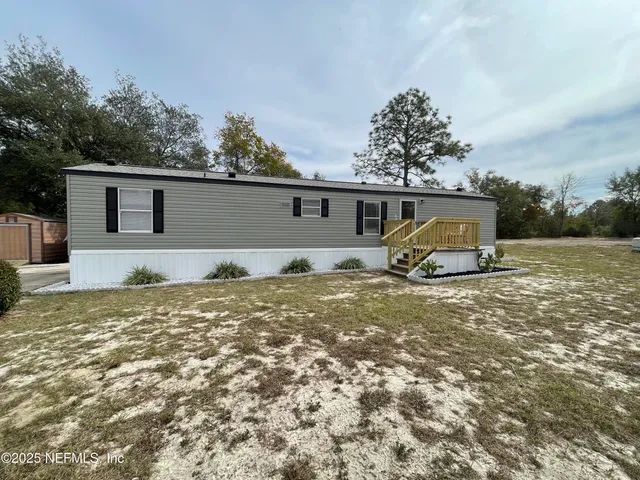 a house view with a backyard space