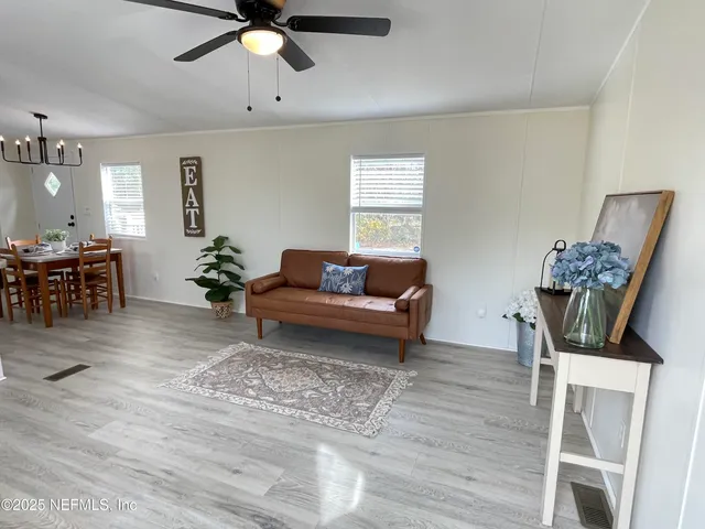 a living room with furniture and a window