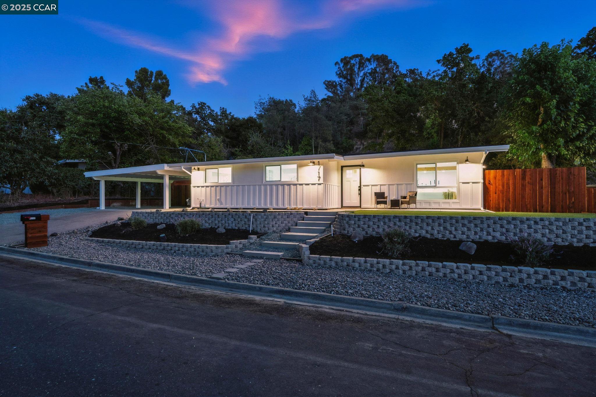 a view of a house with a street