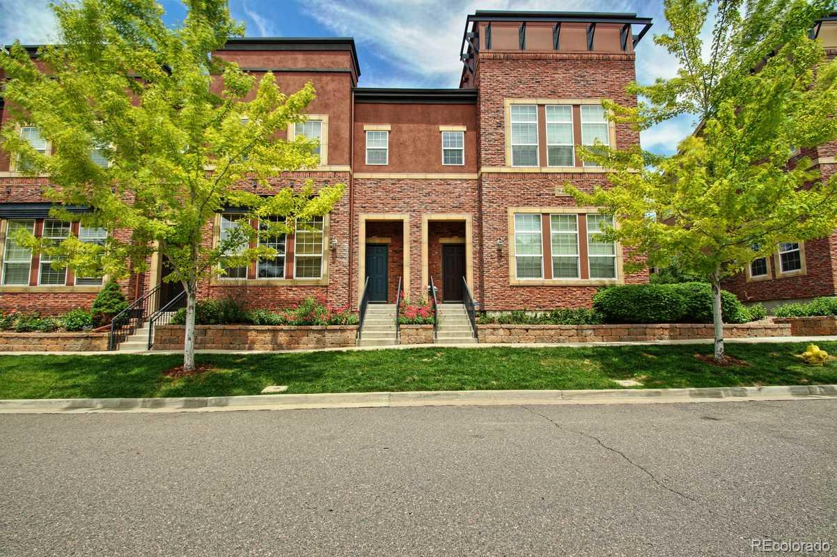 9452 Elmhurst Lane, Unit D Highlands Ranch, CO 80129 - Photo 1 of 1 front view of a house with a yard