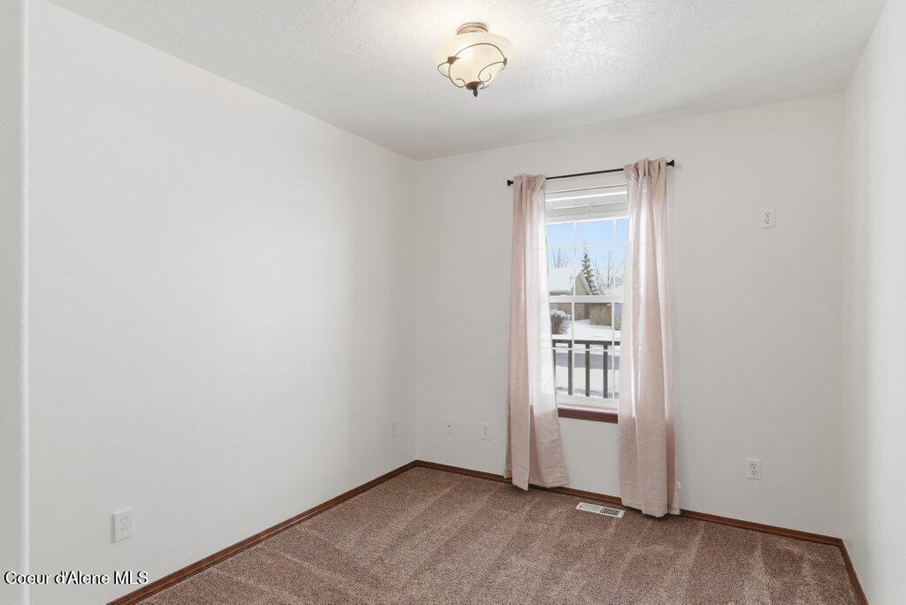 2444 North Sparrow Loop Post Falls, ID 83854 - Photo 13 of 39 Downstairs Bedroom