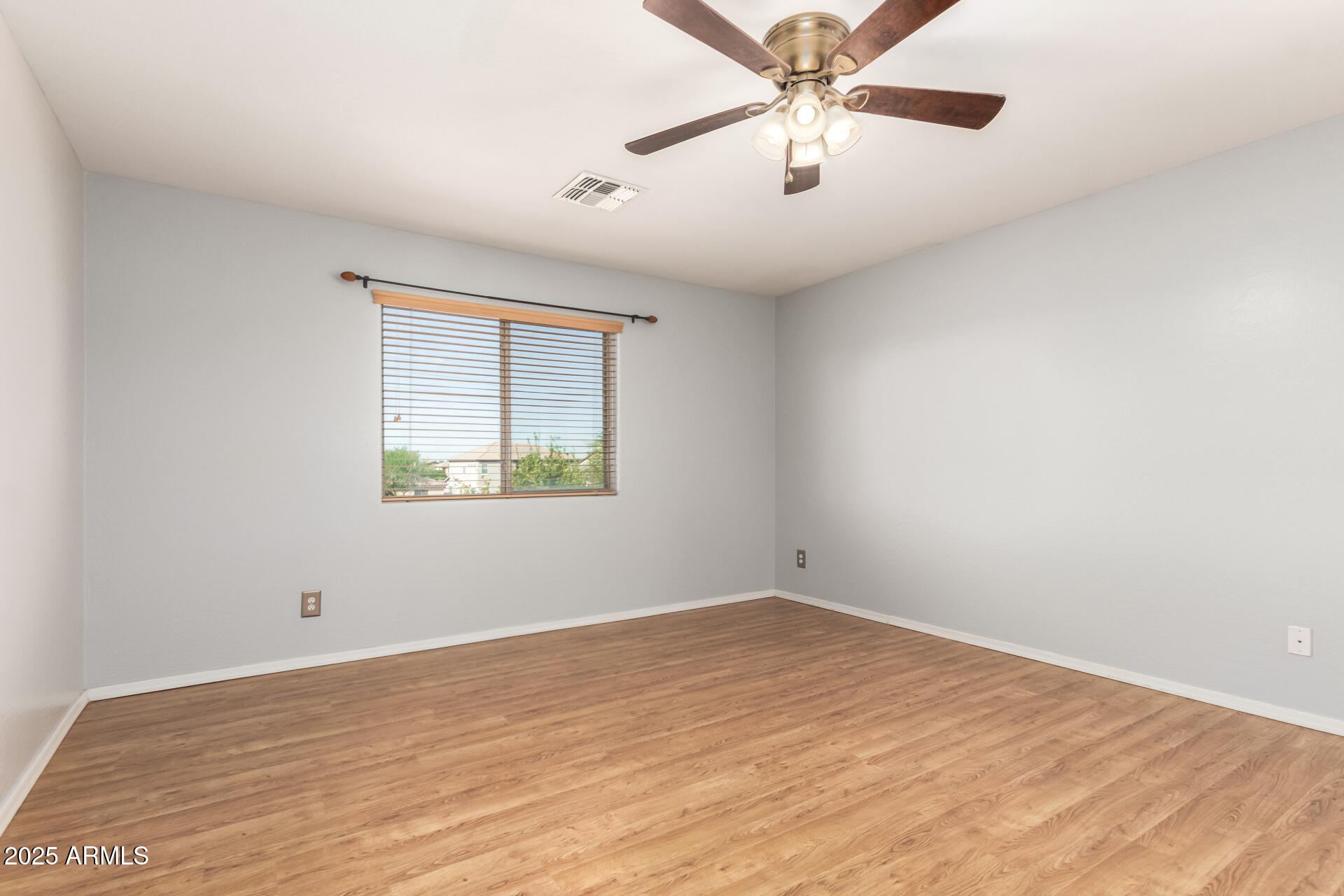 6756 South Seton Avenue Gilbert, AZ 85298 - Photo 11 of 37 wooden floor in an empty room with a window