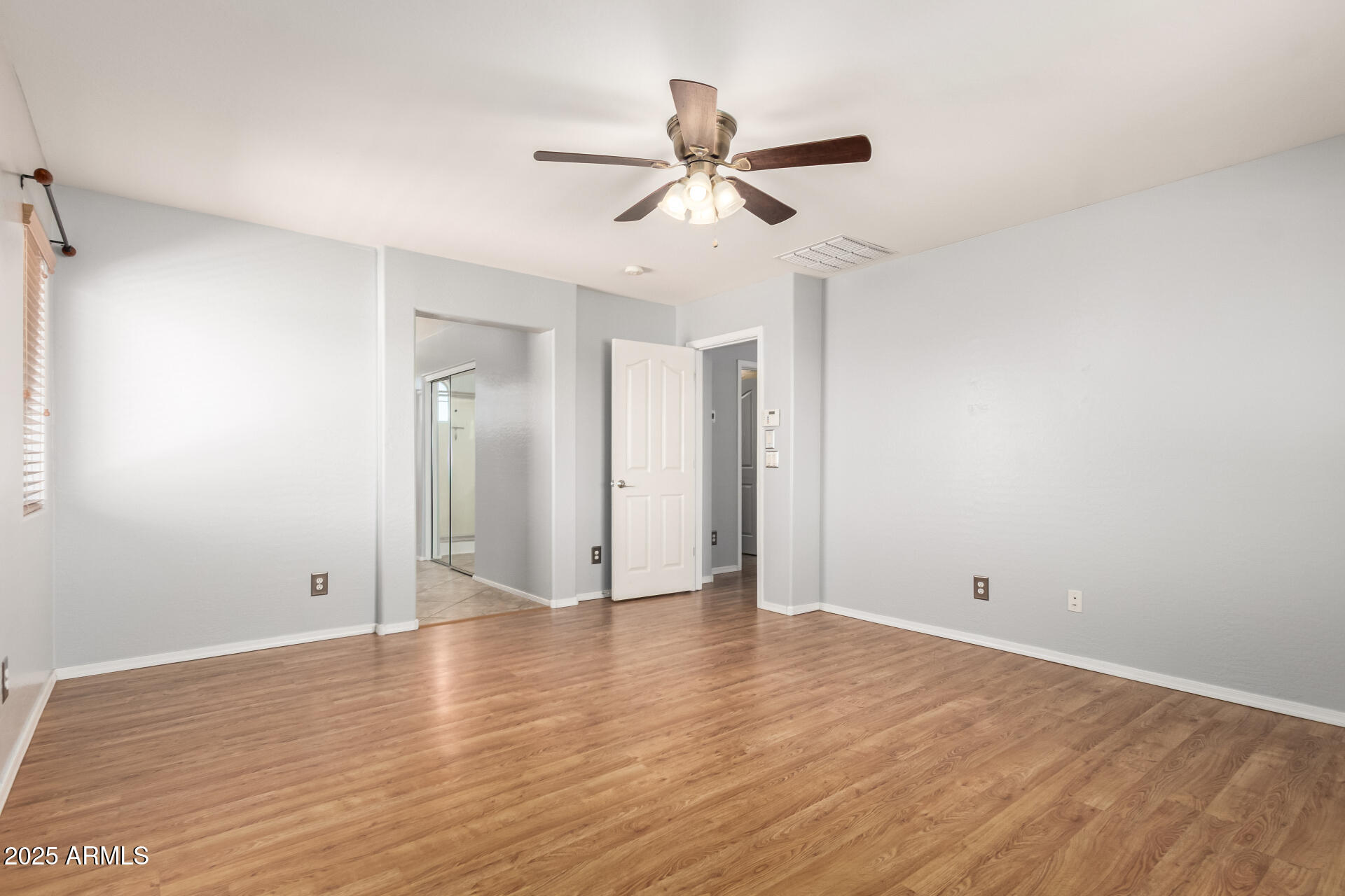 6756 South Seton Avenue Gilbert, AZ 85298 - Photo 12 of 37 a view of an empty room with wooden floor