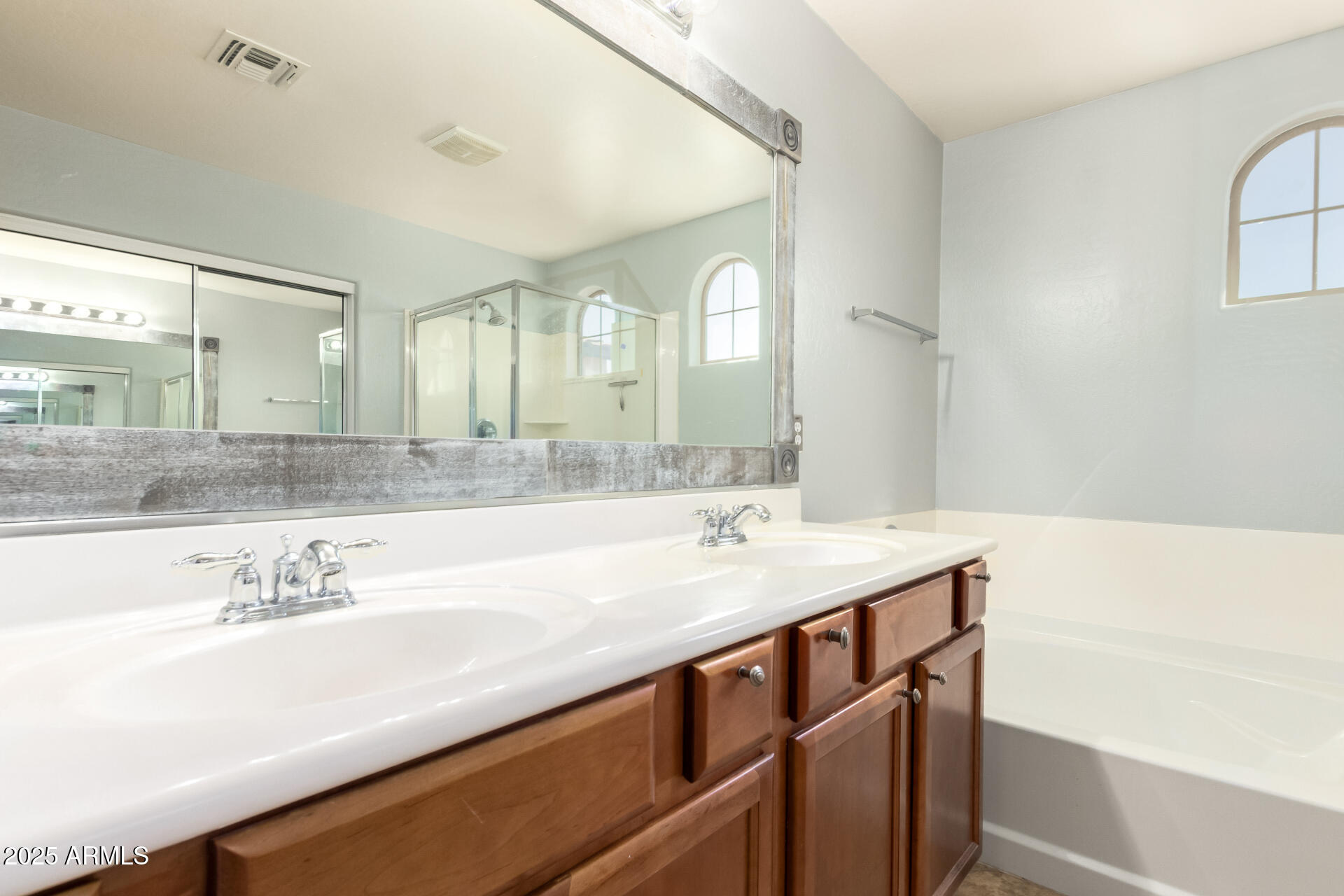 6756 South Seton Avenue Gilbert, AZ 85298 - Photo 14 of 37 a bathroom with a sink and a mirror