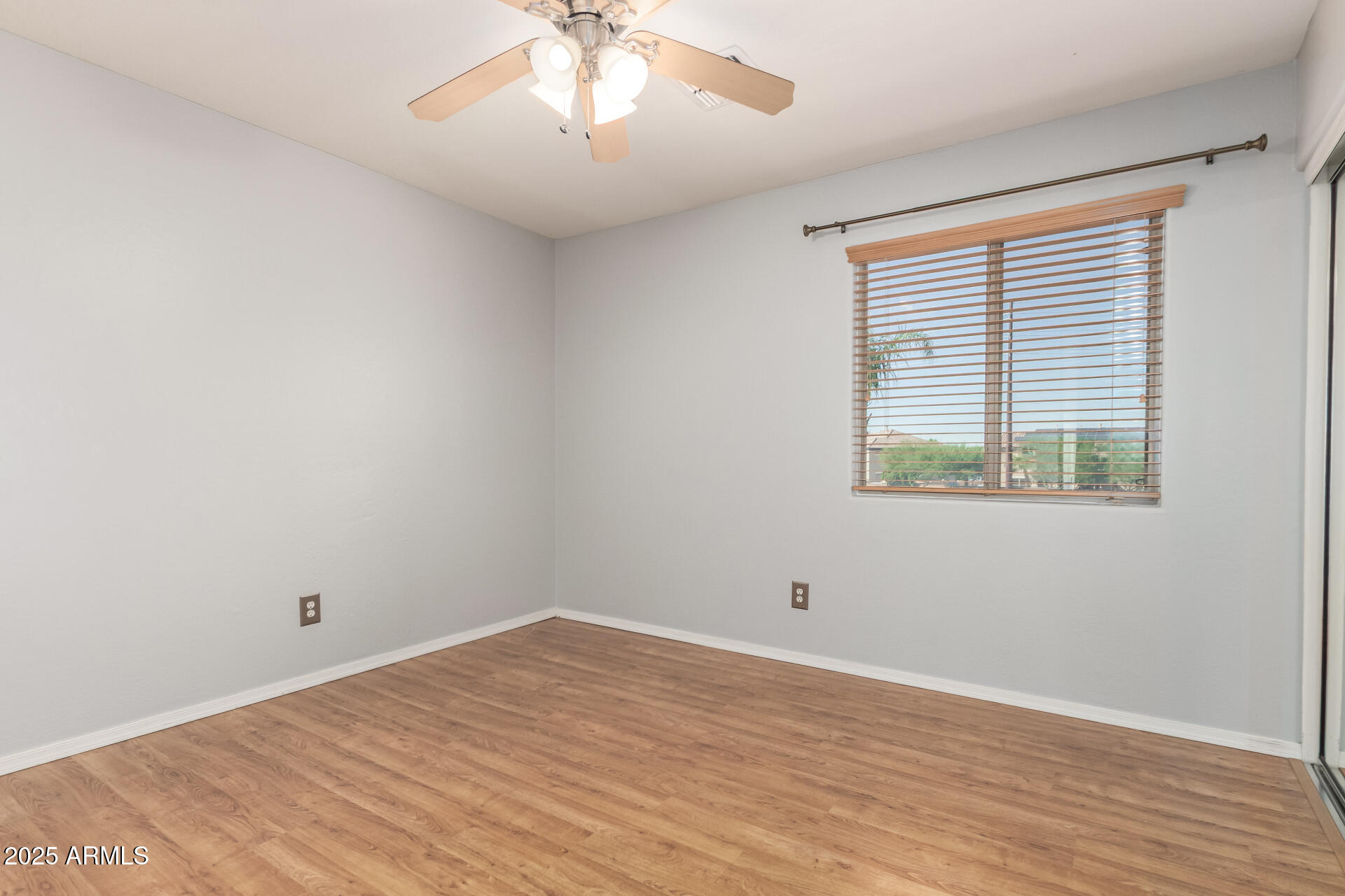 6756 South Seton Avenue Gilbert, AZ 85298 - Photo 17 of 37 a view of empty room with wooden floor and fan