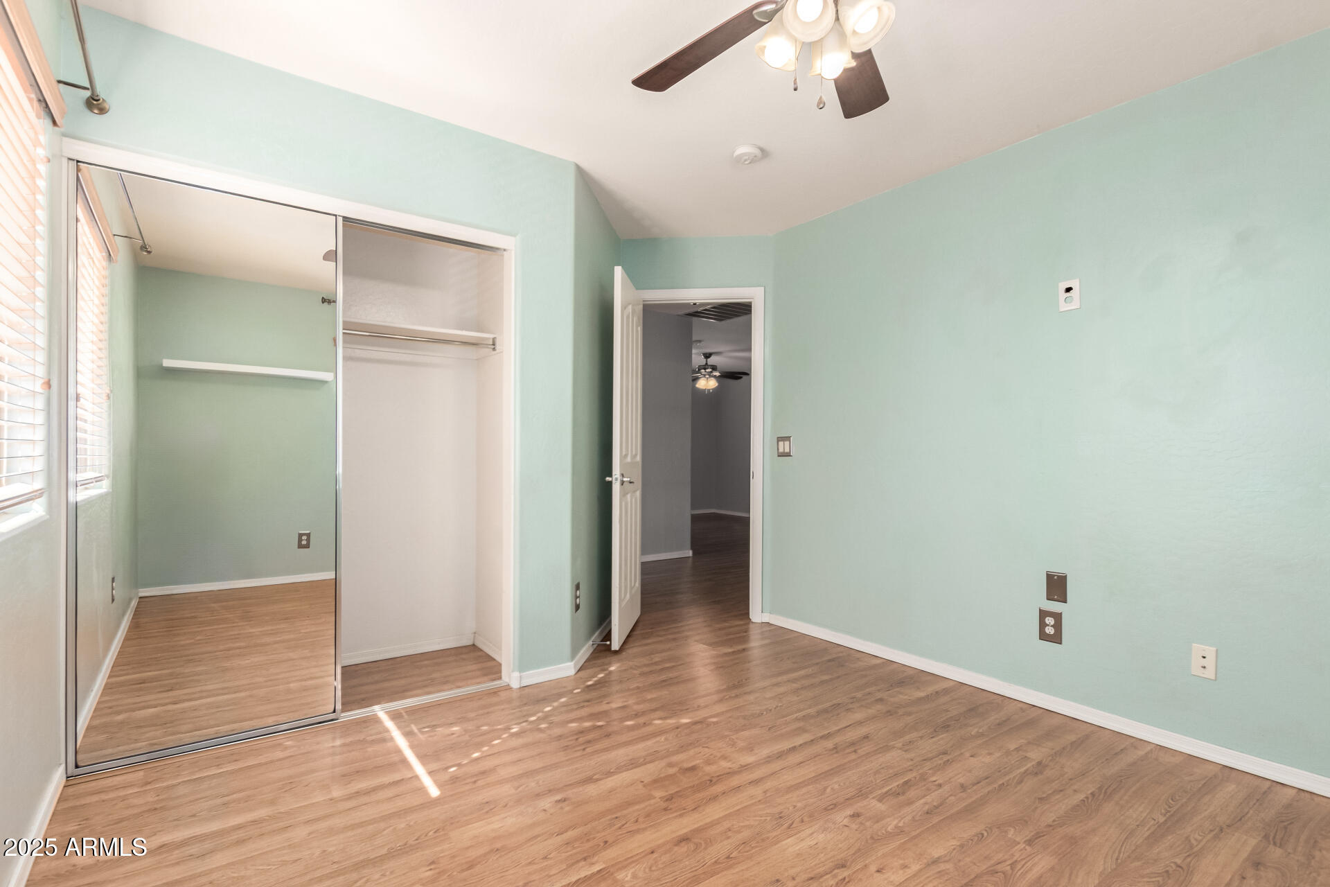 6756 South Seton Avenue Gilbert, AZ 85298 - Photo 20 of 37 wooden floor in an empty room with a window
