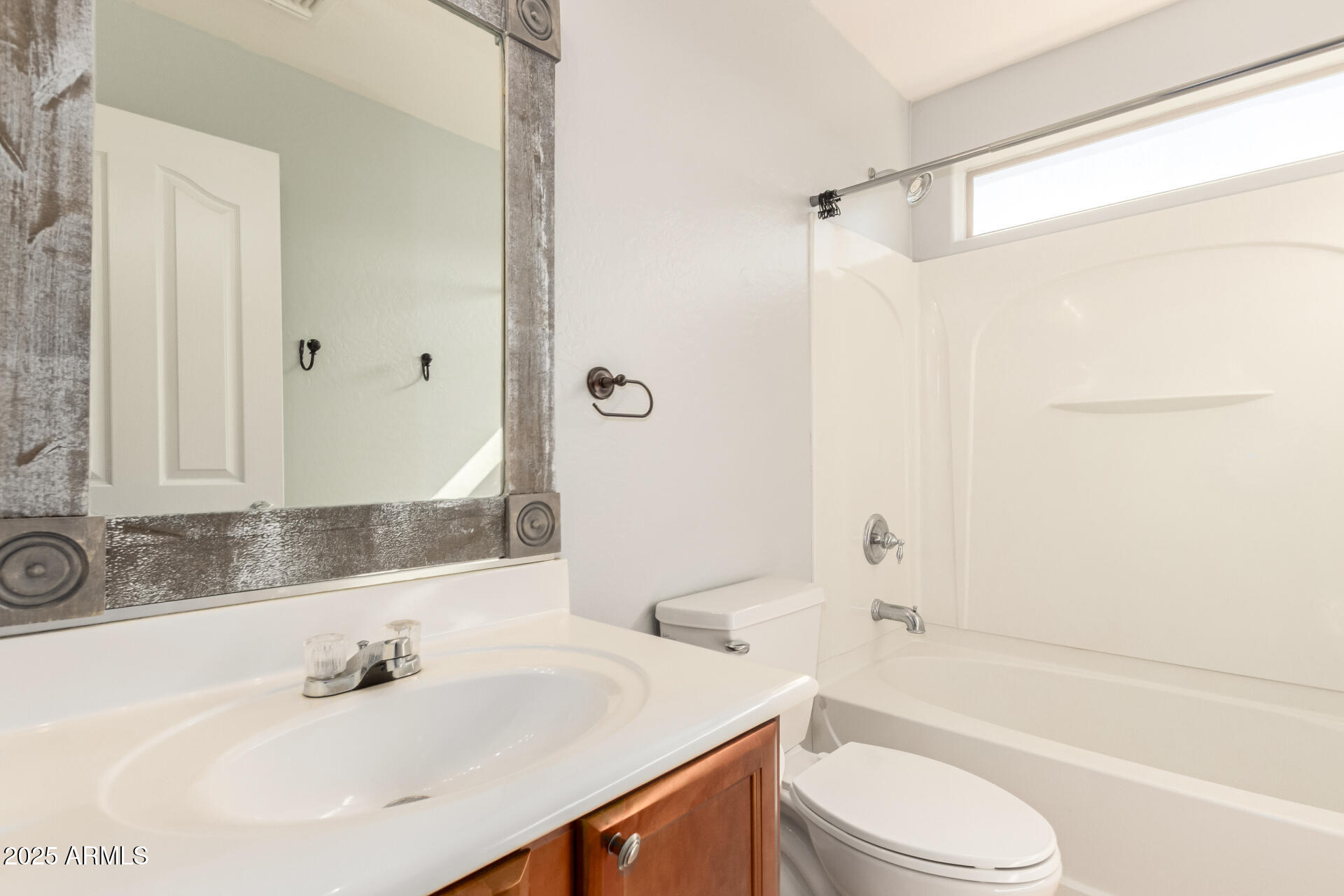 6756 South Seton Avenue Gilbert, AZ 85298 - Photo 21 of 37 a bathroom with a sink a toilet and a bathtub