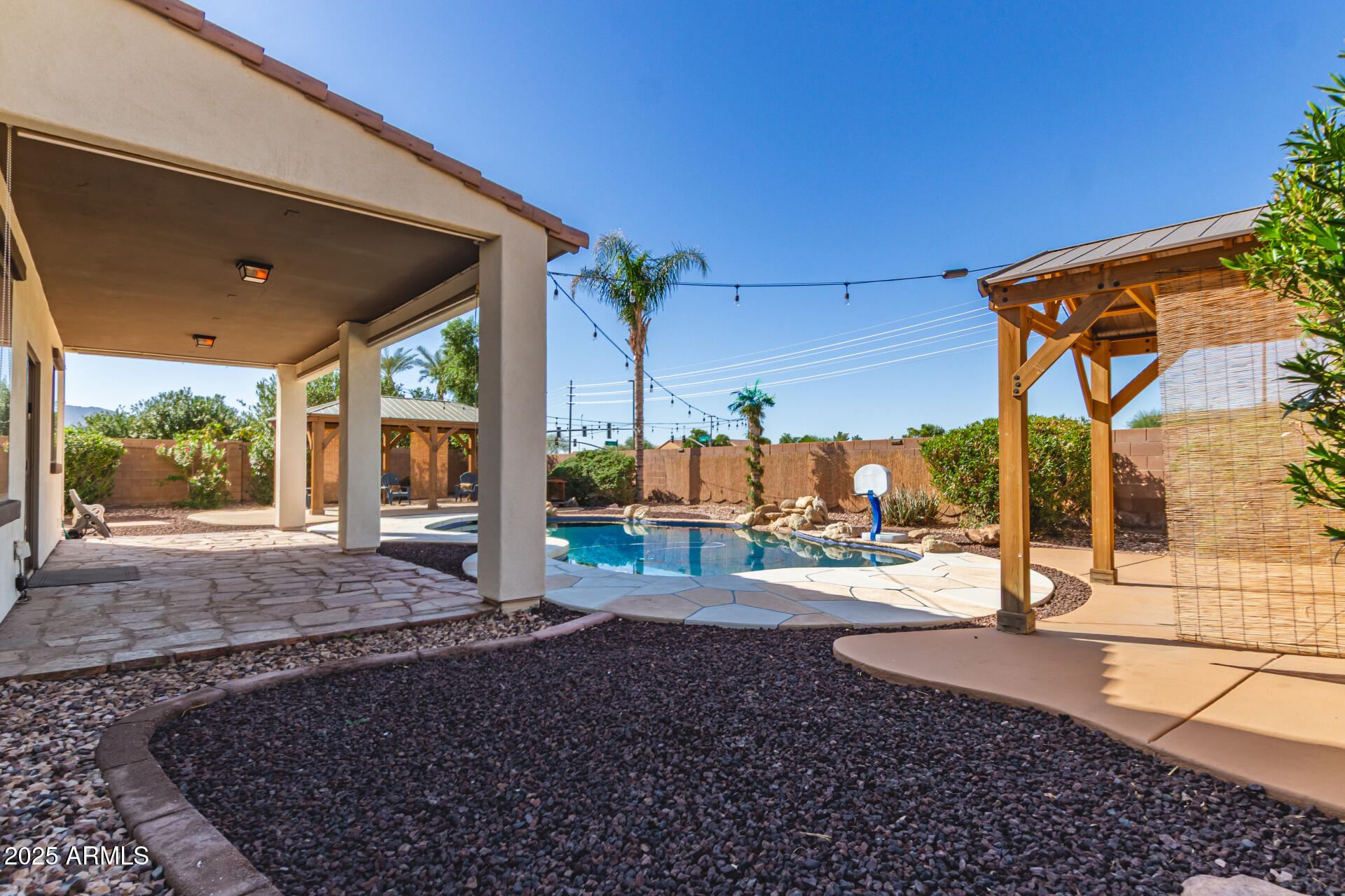6756 South Seton Avenue Gilbert, AZ 85298 - Photo 27 of 37 a view of a backyard with porch