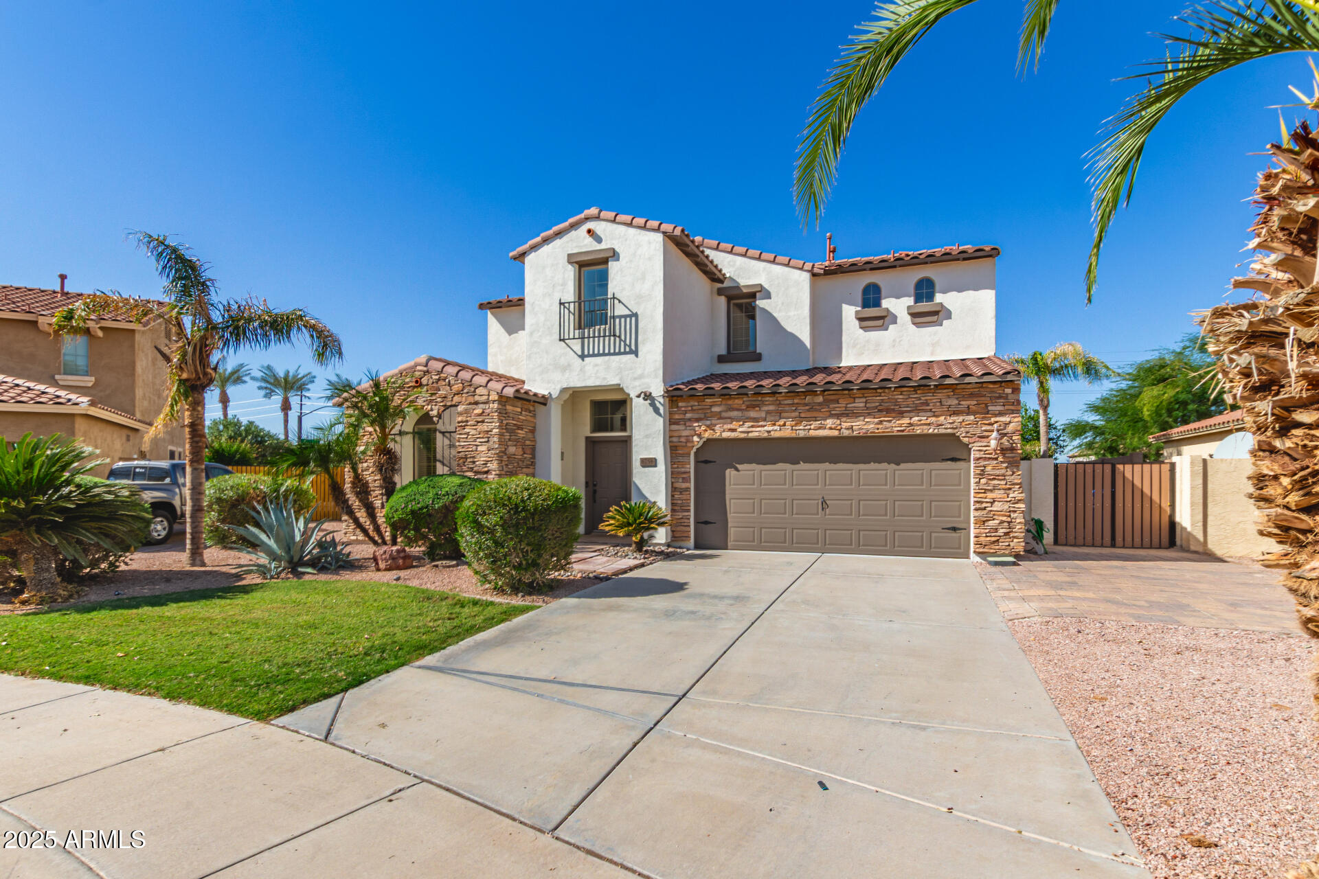 6756 South Seton Avenue Gilbert, AZ 85298 - Photo 30 of 37 a front view of a house with a yard and garage