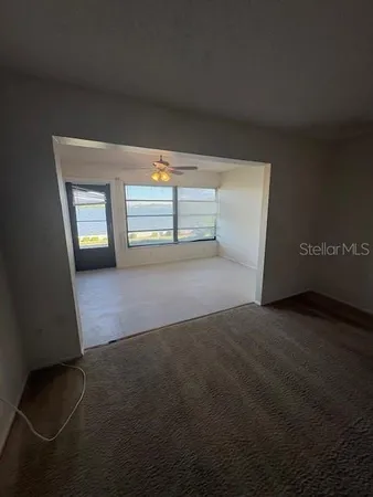 a view of empty room with windows