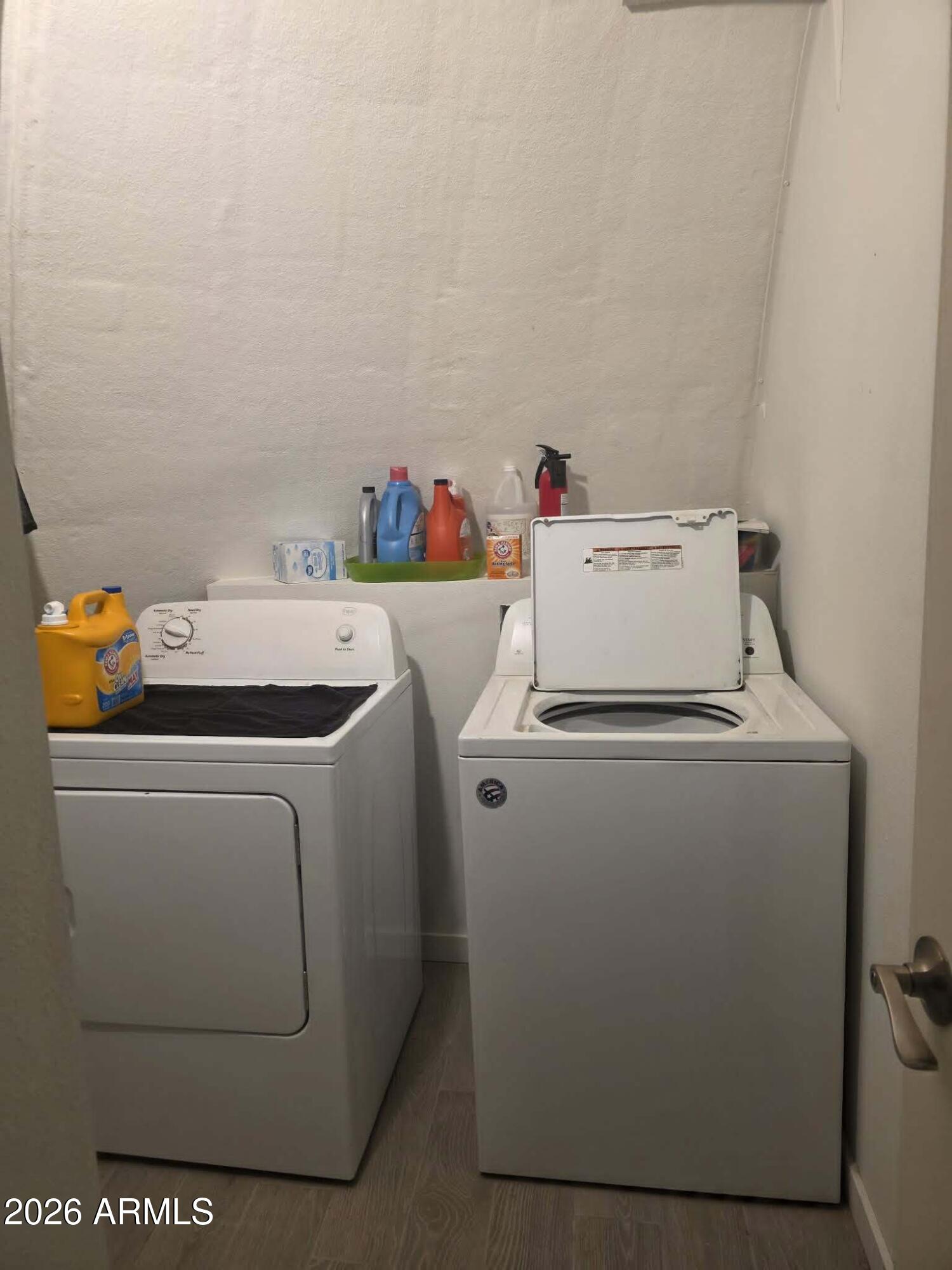1523 South Warren Road Maricopa, AZ 85139 - Photo 24 of 26 a utility room with dryer and washer