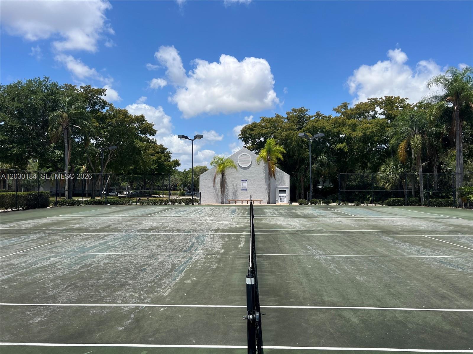 951 Lyons Road, Unit 6104 Coconut Creek, FL 33063 - Photo 18 of 18 a view of a backyard