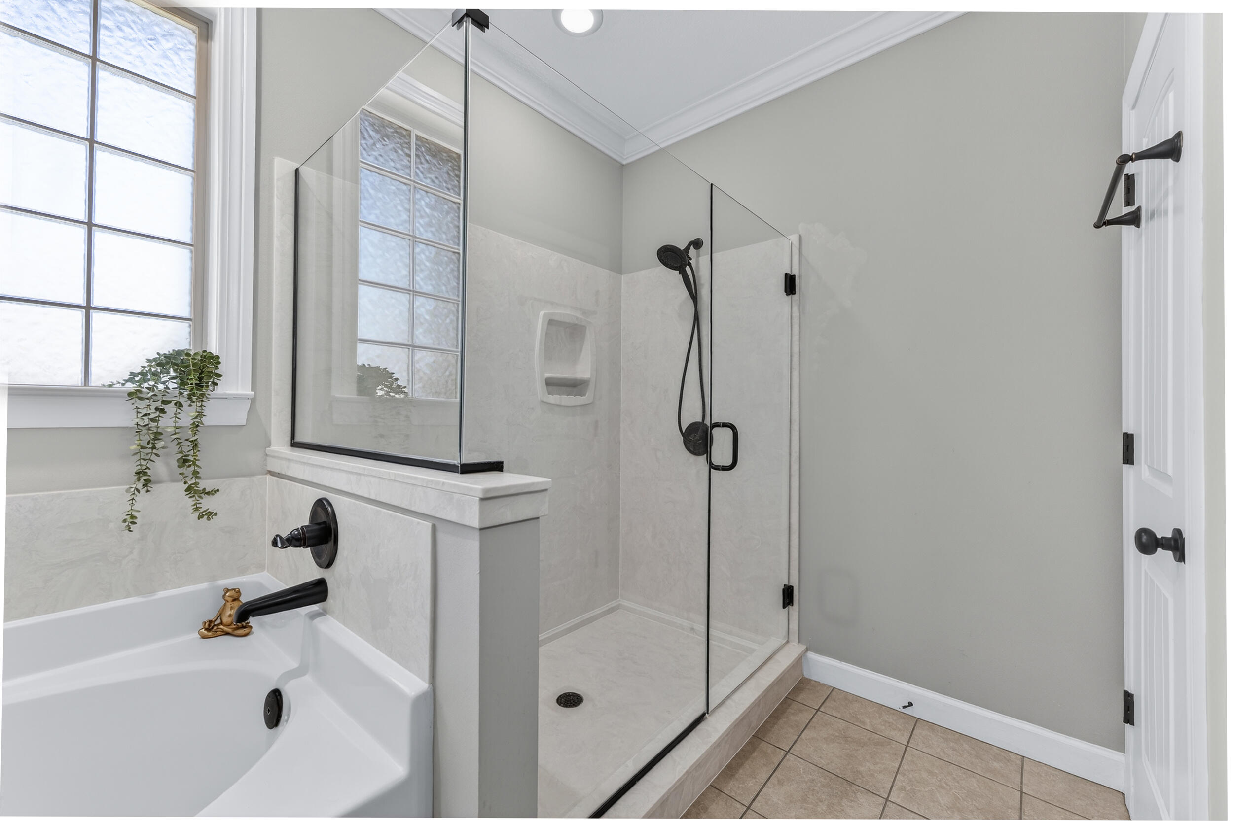 6022 Hidden Valley Road Crestview, FL 32539 - Photo 11 of 60 a bathroom with a bathtub and a shower