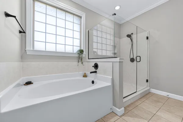 a kitchen with stainless steel appliances granite countertop a refrigerator a oven a stove and a wooden floors