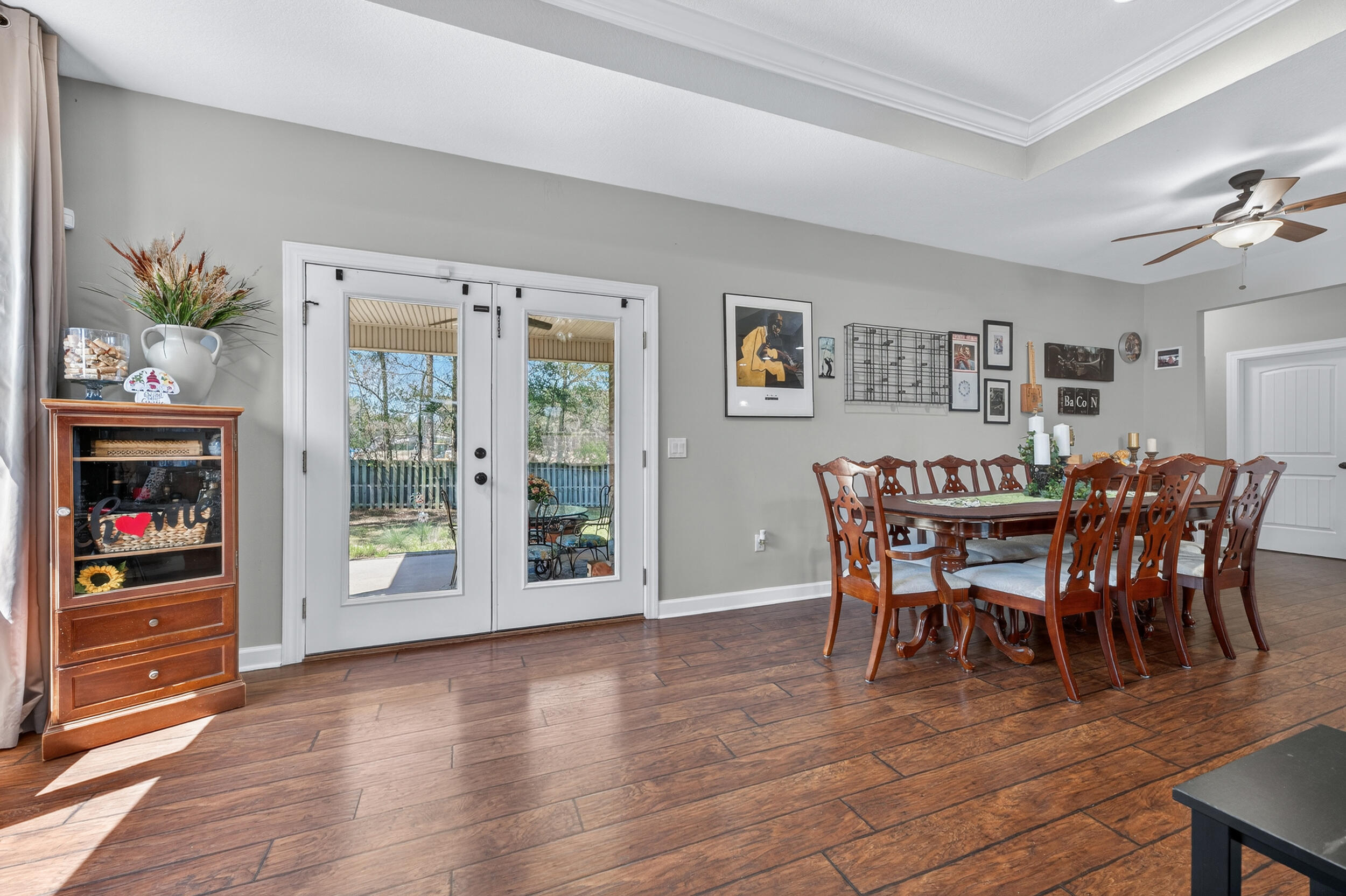 6022 Hidden Valley Road Crestview, FL 32539 - Photo 20 of 60 a view of a dining room with furniture window and wooden floor