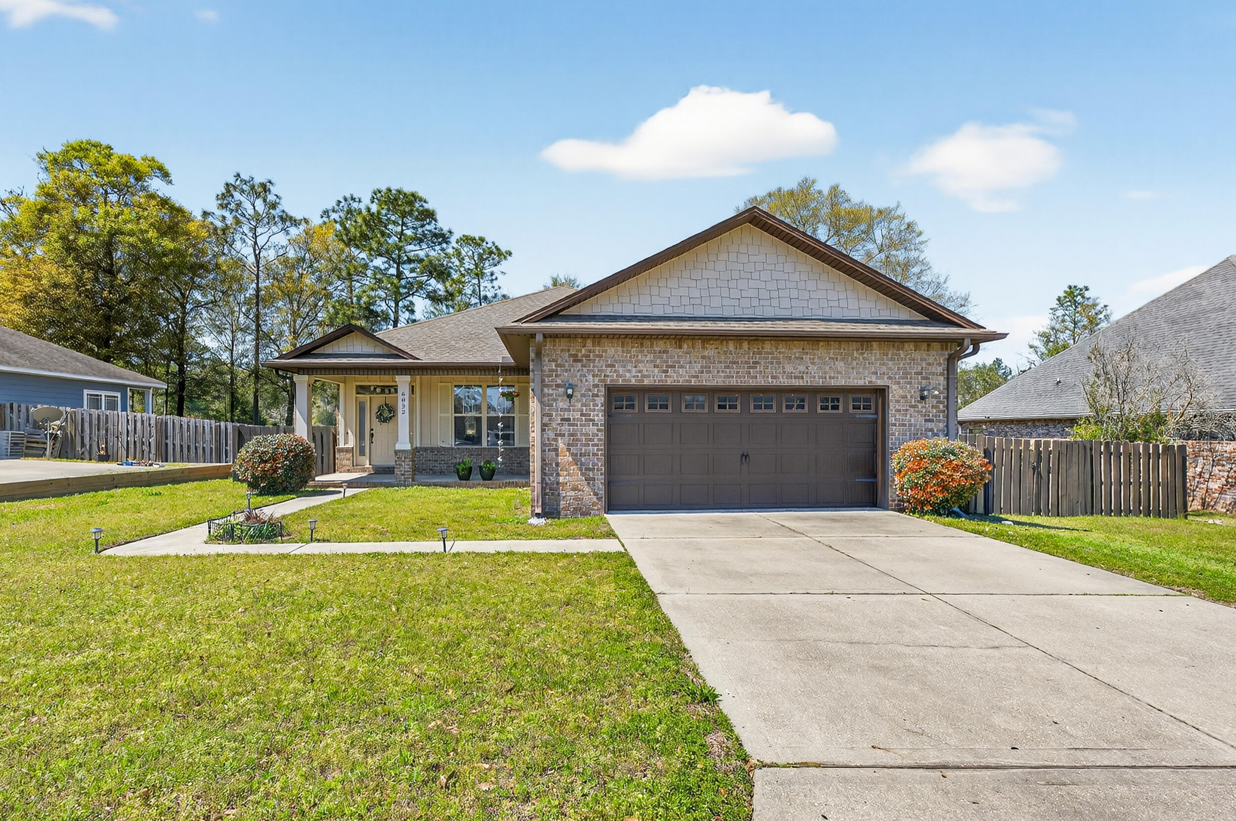 6022 Hidden Valley Road Crestview, FL 32539 - Photo 2 of 60 a house with swimming pool in front of it