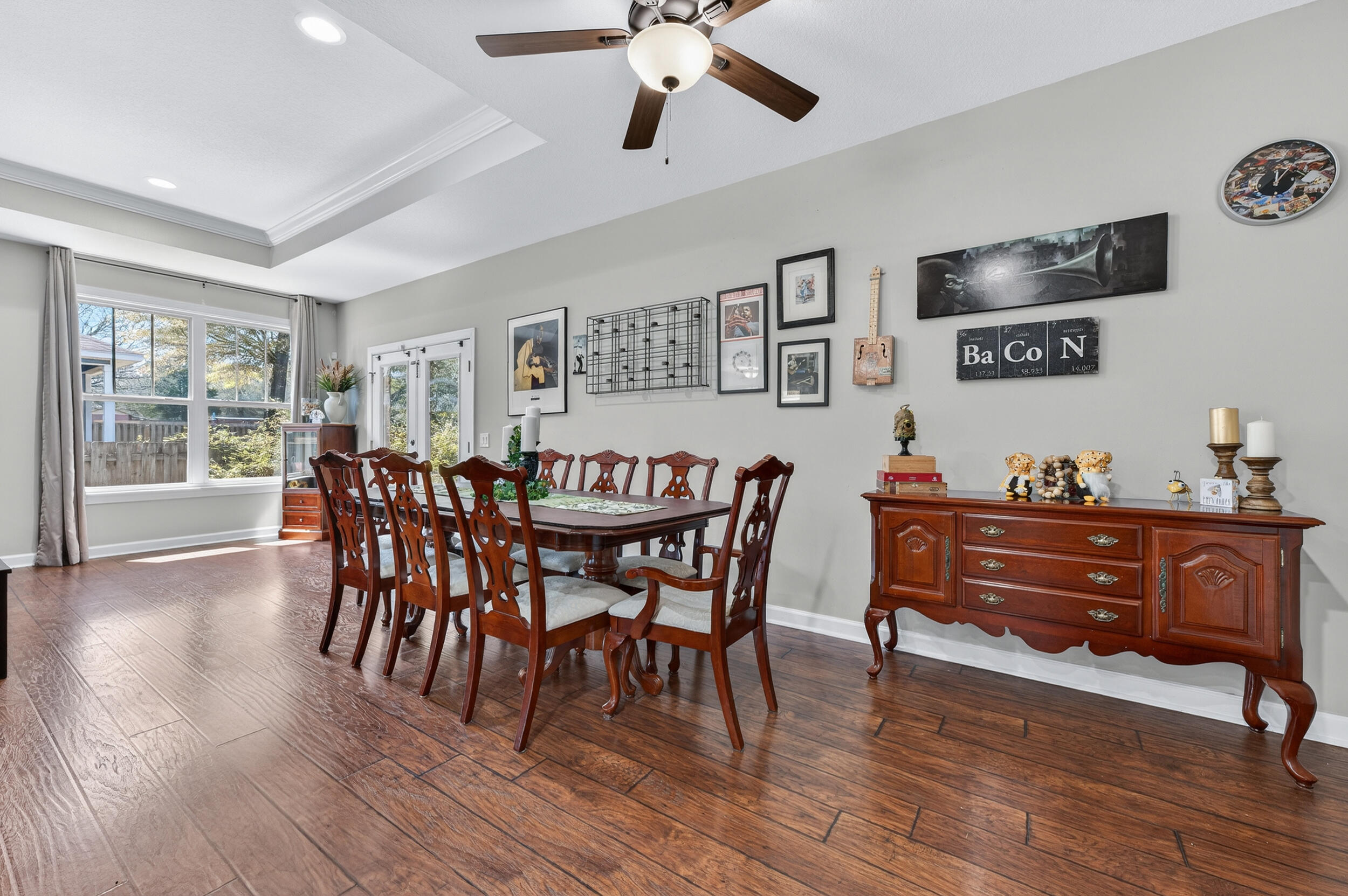 6022 Hidden Valley Road Crestview, FL 32539 - Photo 29 of 60 a view of a dining room with furniture window and wooden floor