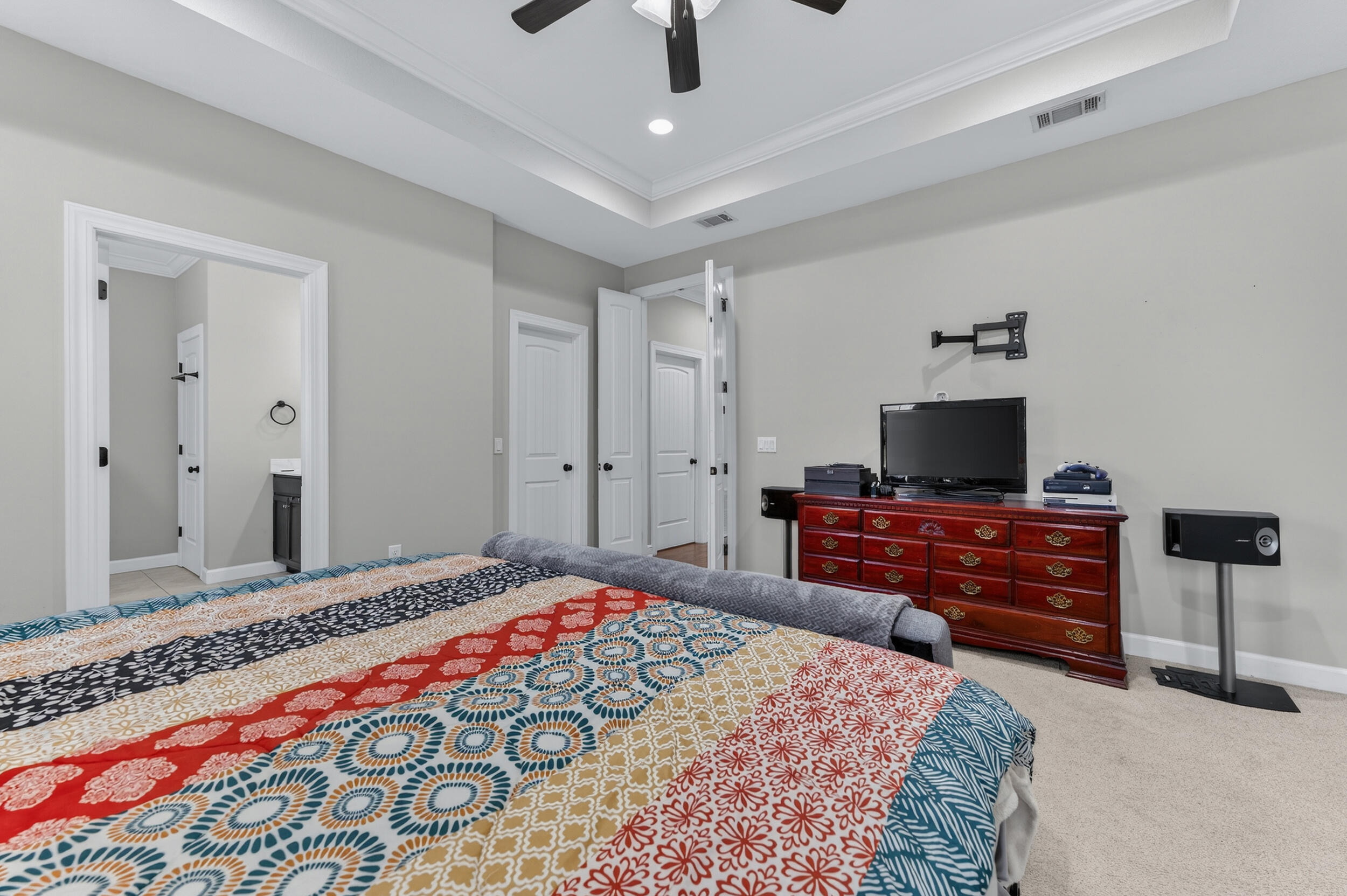6022 Hidden Valley Road Crestview, FL 32539 - Photo 34 of 60 a bedroom with a bed and wooden floor