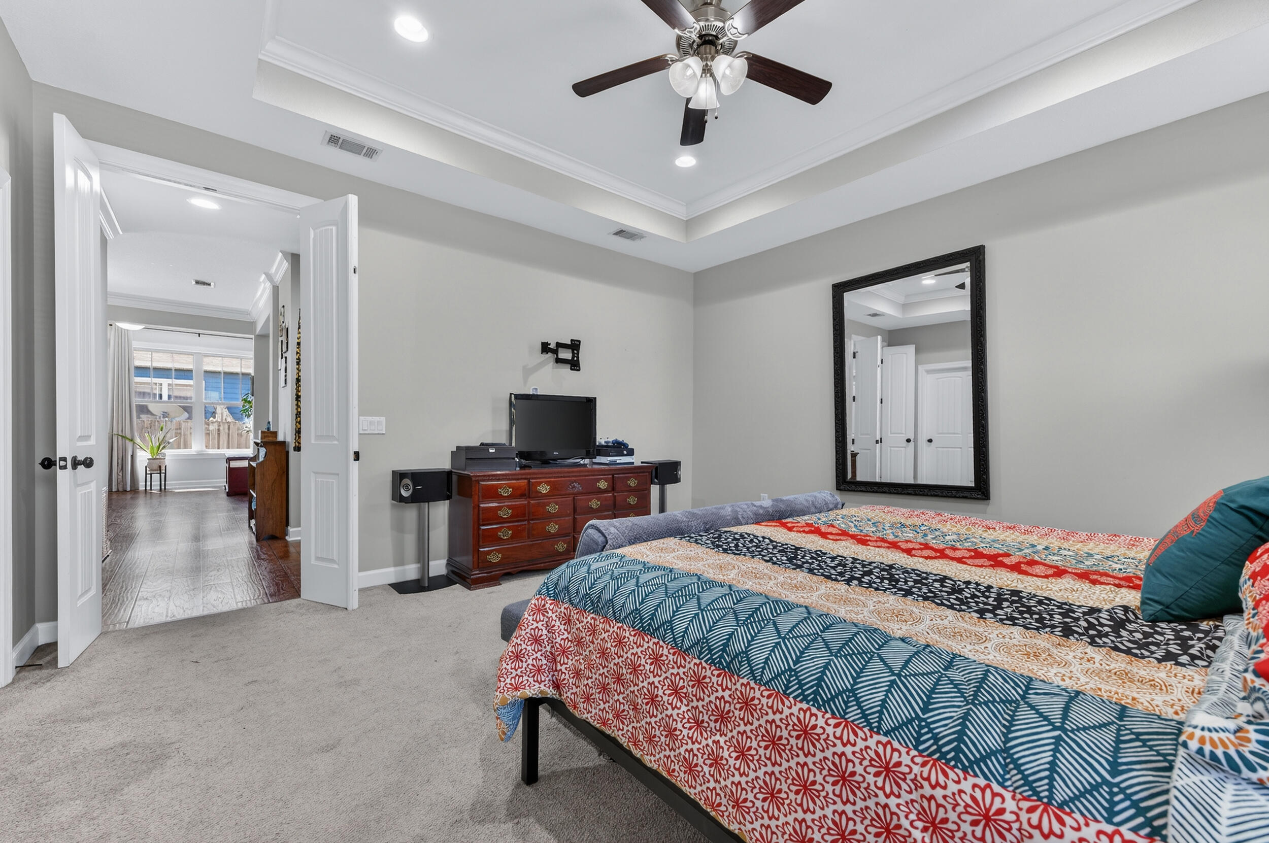 6022 Hidden Valley Road Crestview, FL 32539 - Photo 35 of 60 a bedroom with a bed and a chandelier