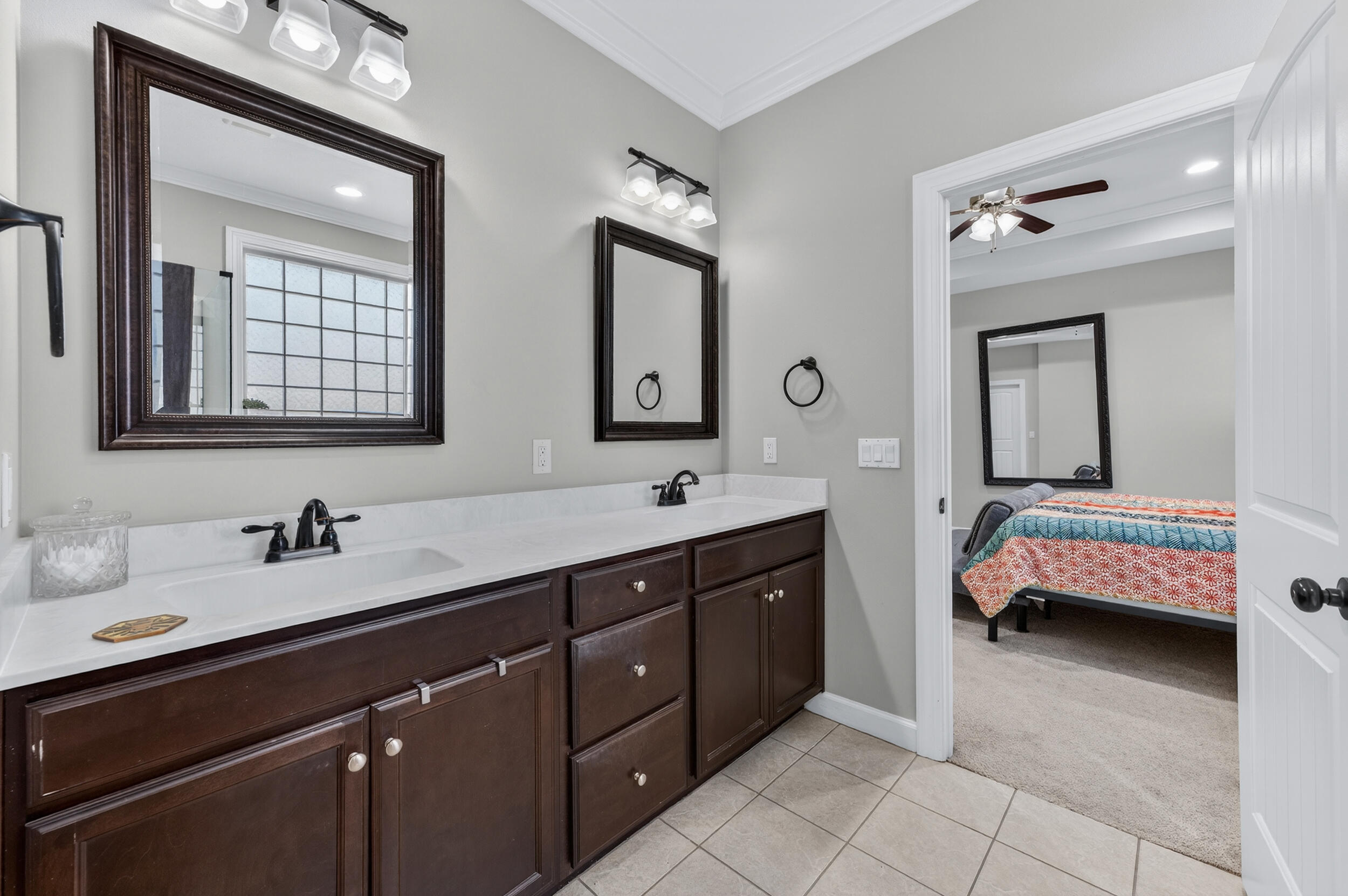 6022 Hidden Valley Road Crestview, FL 32539 - Photo 37 of 60 a en suite bathroom with a double vanity sink and a mirror