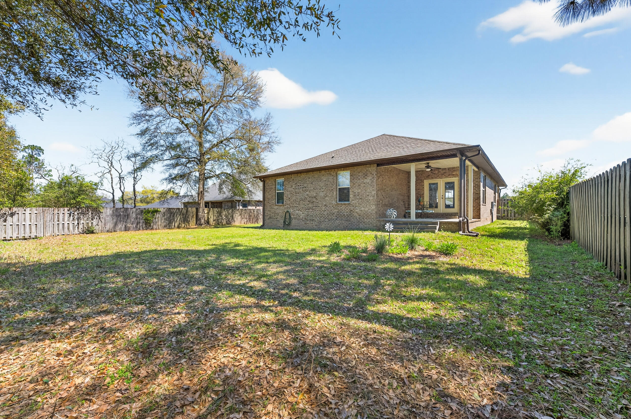 6022 Hidden Valley Road Crestview, FL 32539 - Photo 55 of 60 a view of a house with a yard