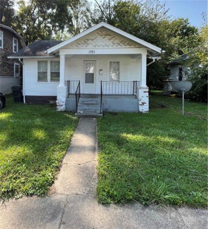 1751 East Johns Avenue Decatur, IL 62521 - Photo 1 of 1 front view of a house with a yard