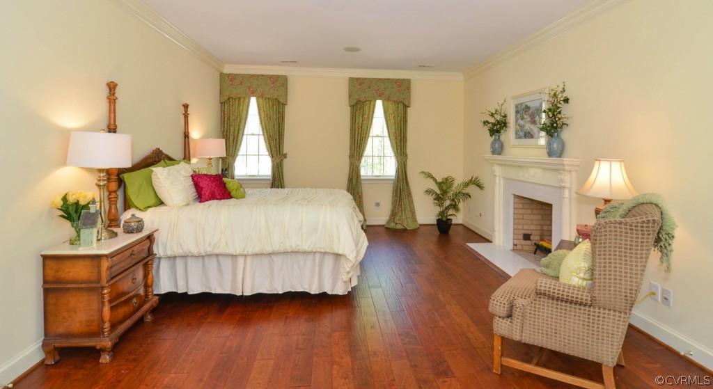 1933 Covington Road Crozier, VA 23039 - Photo 11 of 24 a bedroom with a bed and wooden floor