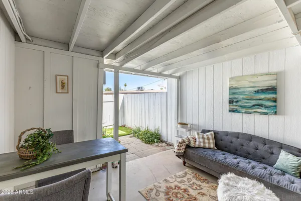 a living room with furniture and a potted plant