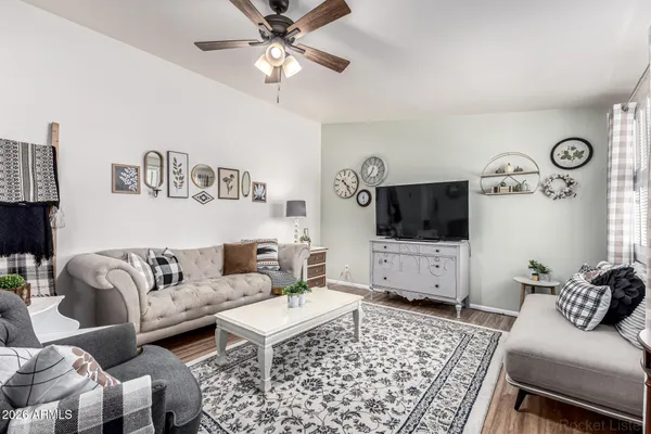 a living room with furniture and a flat screen tv