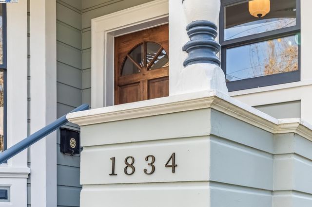a view of front door with wooden floor and door
