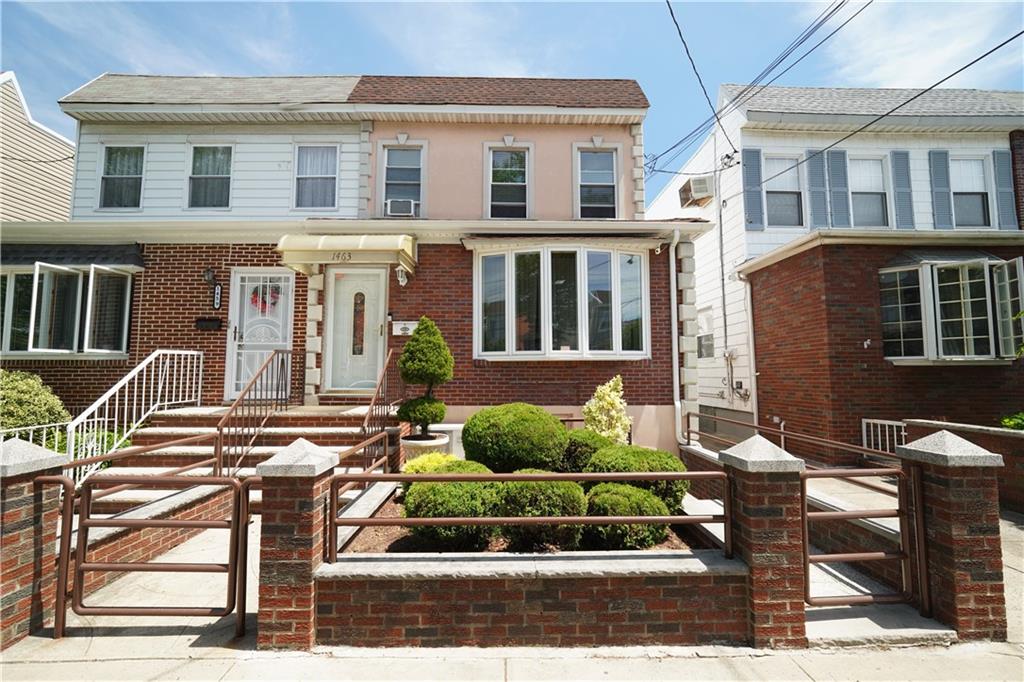 1463 84th Street Brooklyn, NY 11228 - Photo 1 of 30 a front view of a house with garden