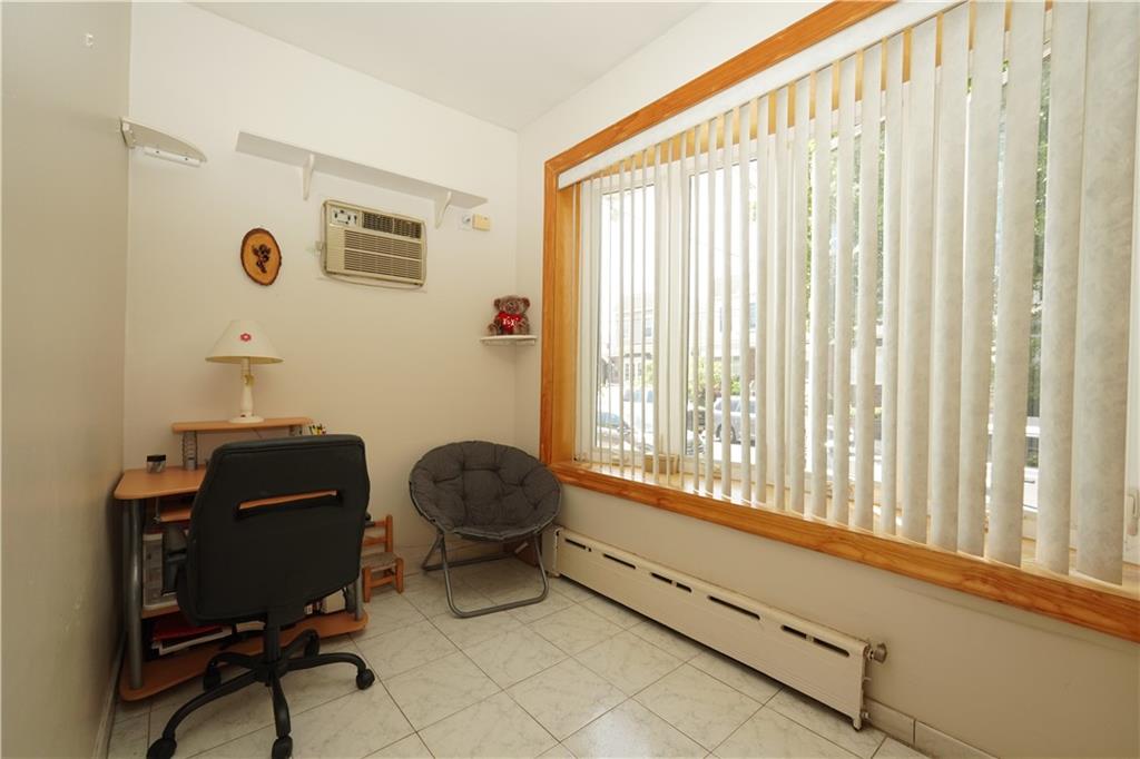 1463 84th Street Brooklyn, NY 11228 - Photo 12 of 30 a living room with furniture and a window
