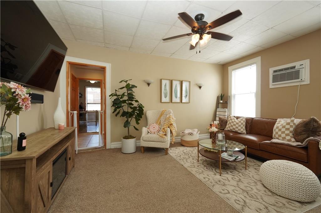 1463 84th Street Brooklyn, NY 11228 - Photo 15 of 30 a living room with furniture and a flat screen tv
