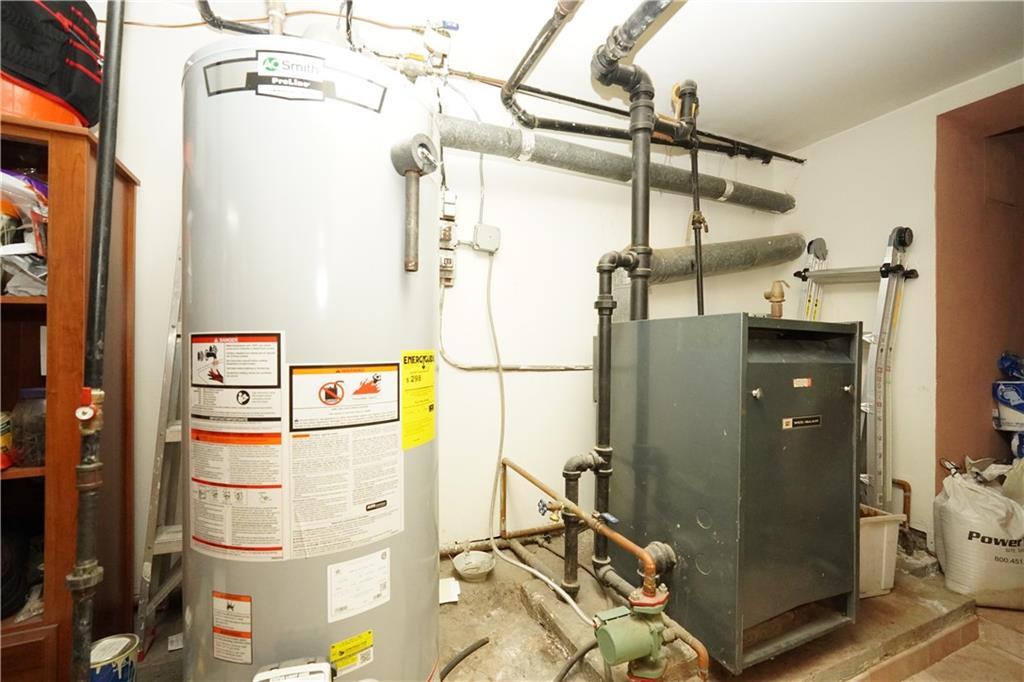 1463 84th Street Brooklyn, NY 11228 - Photo 27 of 30 a utility room with dryer and washer