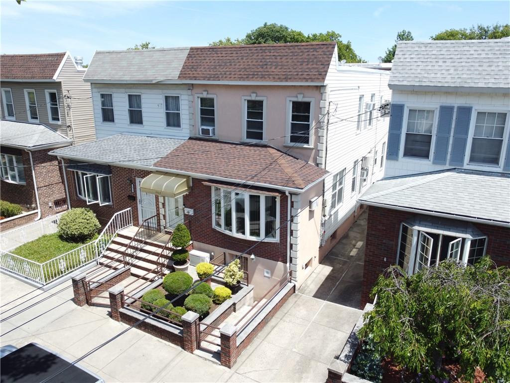 1463 84th Street Brooklyn, NY 11228 - Photo 3 of 30 a front view of a house with garden