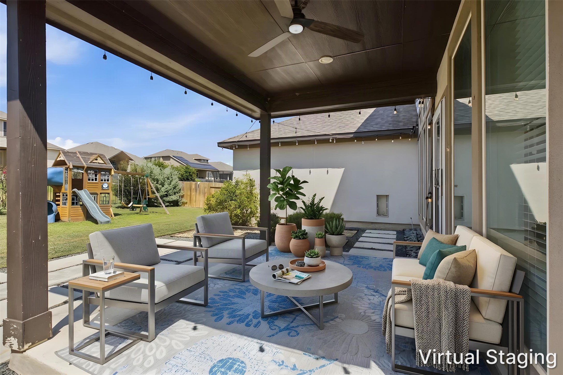 3101 Rabbit Creek Drive Georgetown, TX 78626 - Photo 25 of 38 An inviting covered patio with string lights and ceiling fans offers comfortable outdoor living overlooking a lush green lawn.