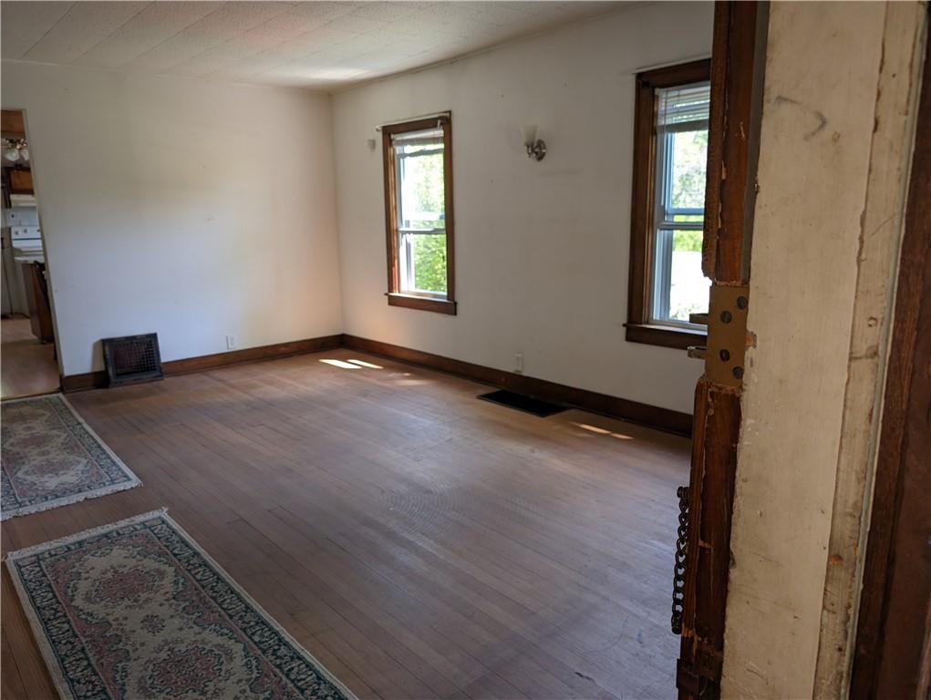 488 Highland Ridge Road Claysville, PA 15323 - Photo 14 of 29 an empty room with wooden floor and windows