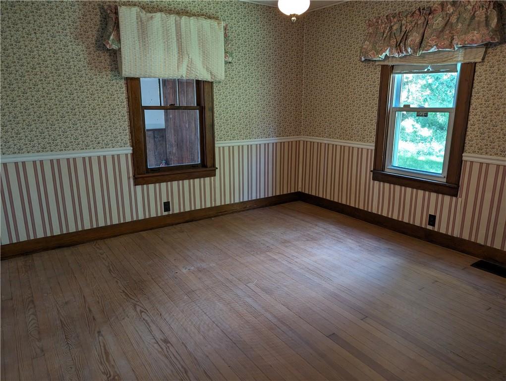 488 Highland Ridge Road Claysville, PA 15323 - Photo 18 of 29 an empty room with wooden floor and windows