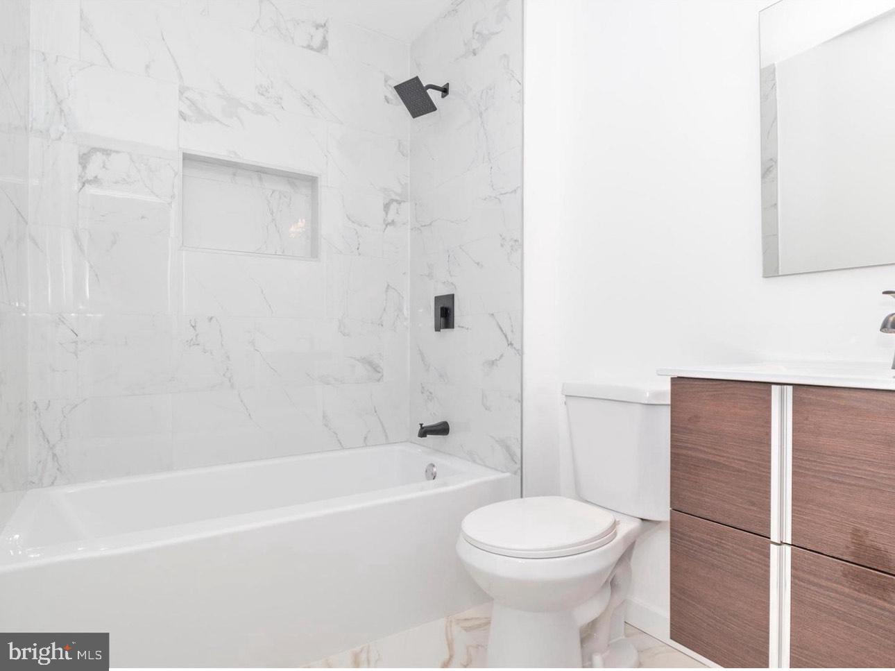 3930 Ferrara Drive Silver Spring, MD 20906 - Photo 15 of 15 a bathroom with a toilet sink and shower