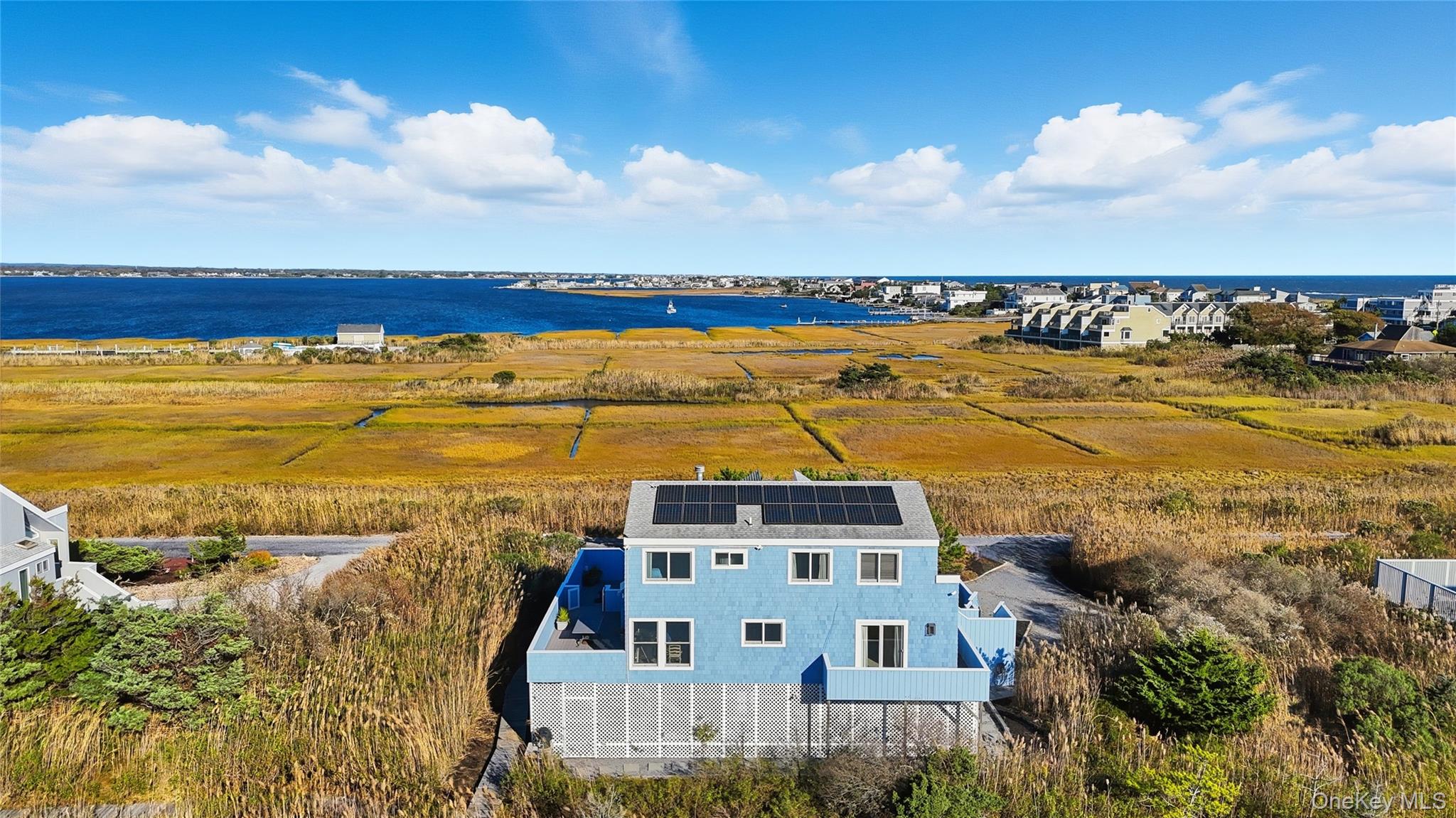 556 Dune Road Westhampton, NY 11978 - Photo 5 of 20 a view of a lake with a city